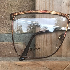 GUCCI vintage women&#39;s eyeglass frame, bronze-colored striped metal