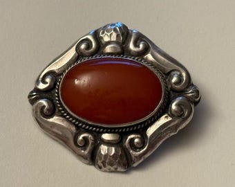 Silverbrosch med bärnsten