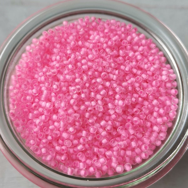 Toho - Seed Beads 11/0 GLASPERLEN crystal / neon carnation lined