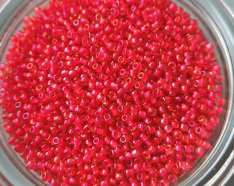 Toho - Seed Beads 11/0 GLASPERLEN leuchtendes Topaz Neon Pink - lined