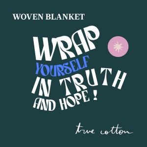 May include: A white woven blanket with the text "WRAP YOURSELF IN TRUTH AND HOPE!" in a blue and white font. The blanket is on a dark green background with a pink circle with a white star in the upper right corner. The text "true cotton" is written in cursive at the bottom of the image.