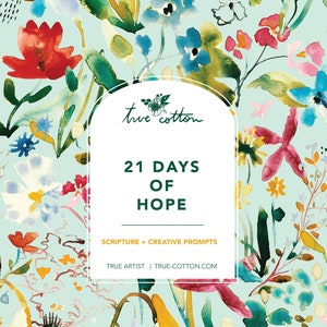 May include: A light blue background with a watercolour floral pattern in shades of red, yellow, green, blue, and pink. The text "true cotton" is in a green circle at the top of the image. The text "21 DAYS OF HOPE" is in black text below the circle. The text "SCRIPTURE + CREATIVE PROMPTS" is in black text below the title. The text "TRUE ARTIST | TRUE-COTTON.COM" is in black text below the prompts.