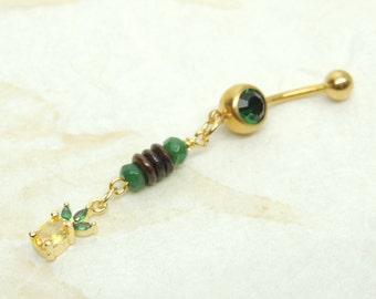 May include: Gold belly button ring with a green gem, brown and green beads, and a small pineapple charm.
