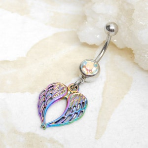 May include: A rainbow iridescent belly button ring with a heart-shaped charm featuring angel wings.