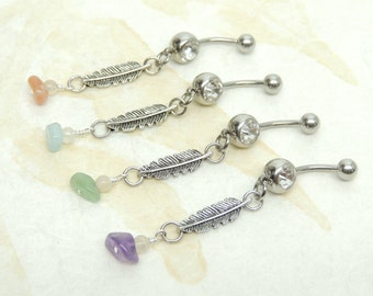 May include: Four belly button rings with a silver feather charm and a crystal bead. Each ring has a different colored gemstone: peach, light blue, green, and purple.