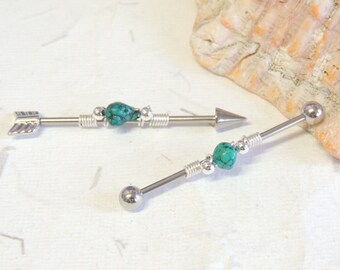 May include: Two silver barbell piercings with turquoise beads and arrowhead and ball ends.