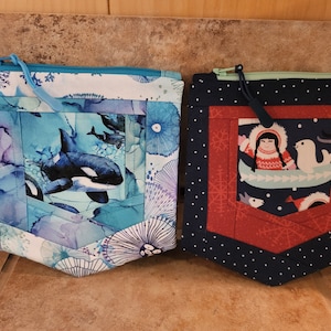 Astuccio/borsa tascabile trapuntata con stampa di ragazza artica o orca