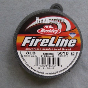 May include: A spool of 8lb FireLine microfused braided bead thread in smoke color. The spool is 50 yards and has a 0.007in average diameter. The label also includes the product code FLBT8-42 and the barcode 90524 46535.