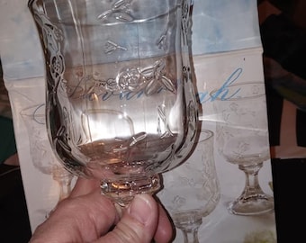 May include: Set of four clear glass goblets with a floral design. The goblets are part of the Anchor Hocking Savannah collection.