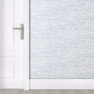 May include: A white door with a silver door handle is partially open, revealing a light gray wall with a white wave pattern wallpaper.