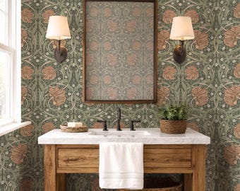 May include: A bathroom with green floral wallpaper, a wooden vanity, and a marble countertop. The vanity has a white towel, a woven basket, and a mirror. Two sconces with lampshades flank the mirror. A small potted plant sits on the countertop.