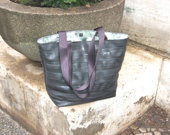 Upcycling shopper made from bicycle tubes and coated cotton in green
