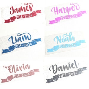 May include: Six glitter iron-on patches with names and dates. The names are James, Harper, Liam, Noah, Olivia, and Daniel. The dates are 2018-2024, 2019-2024, 2019-2024, 2019-2024, 2019-2024, and 2019-2024. The patches are on a white background.