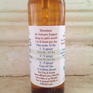 May include: A brown glass bottle with a spray nozzle and a white label. The label has directions for immune support for pets, including dosage recommendations based on weight. The label also includes instructions for using the spray for cuts and scrapes.
