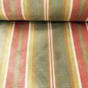 May include: Close-up of a fabric roll with vertical stripes in red, green, and gold. The fabric has a slightly textured appearance, with the stripes varying in width. The colors are muted, giving it a vintage or antique feel.