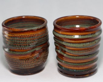 two 8oz tumblers, two handle-less pottery cups with thumb rest (D67)