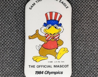 VINTAGE COCA COLA Olympic Pin: 1985 LA Olympics - Mascot w ZAIRE Flag