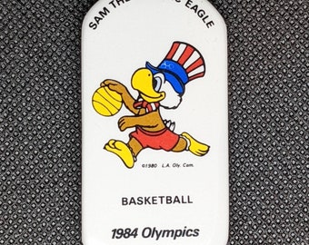 Juegos Olímpicos de Los Ángeles 1984 Sam The Eagle "Basketball" Pin/Button - NUEVO