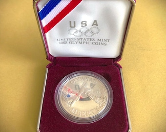 Moneda olímpica de 1988-S de la Casa de la Moneda de EE. UU. Dólar de plata estadounidense antiguo con certificado de autenticidad.