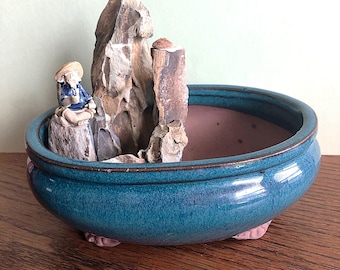 Maceta de cerámica para bonsái. Olla de pesca vintage con forma de hombre de barro.