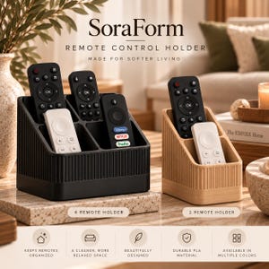 May include: A black four-slot remote control holder and a tan two-slot remote control holder, both featuring vertical ribbed textures. The black holder contains three black remotes and one white remote, while the tan holder contains one black and one white remote.