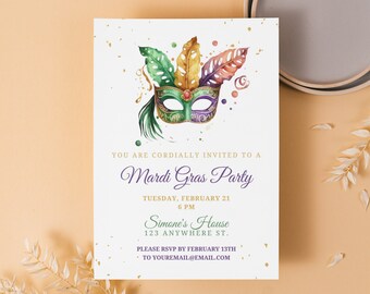 May include: A white invitation card with gold glitter accents. The card features a watercolor illustration of a colorful Mardi Gras mask with green, purple, and gold feathers. The text on the card reads "You are cordially invited to a Mardi Gras Party, Tuesday, February 21, 6 PM, Simone's House, 123 Anywhere St., Please RSVP by February 13th to youremail@email.com."