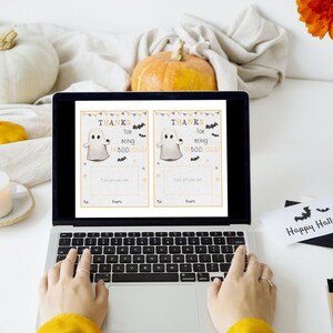 May include: Two printable Halloween thank you cards featuring a ghost with the text "Thanks for being faboolous!" and a place to write "To:" and "From:".