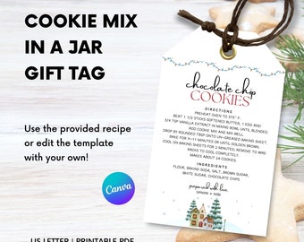 May include: Printable gift tag with a winter village illustration and instructions for making chocolate chip cookies. The tag says "chocolate chip cookies" in red and white text. The directions include preheating the oven to 375 degrees Fahrenheit, beating 1 1/2 sticks of softened butter, 1 egg, and 3/4 teaspoon of vanilla extract. The ingredients include flour, baking soda, salt, brown sugar, white sugar, and chocolate chips.