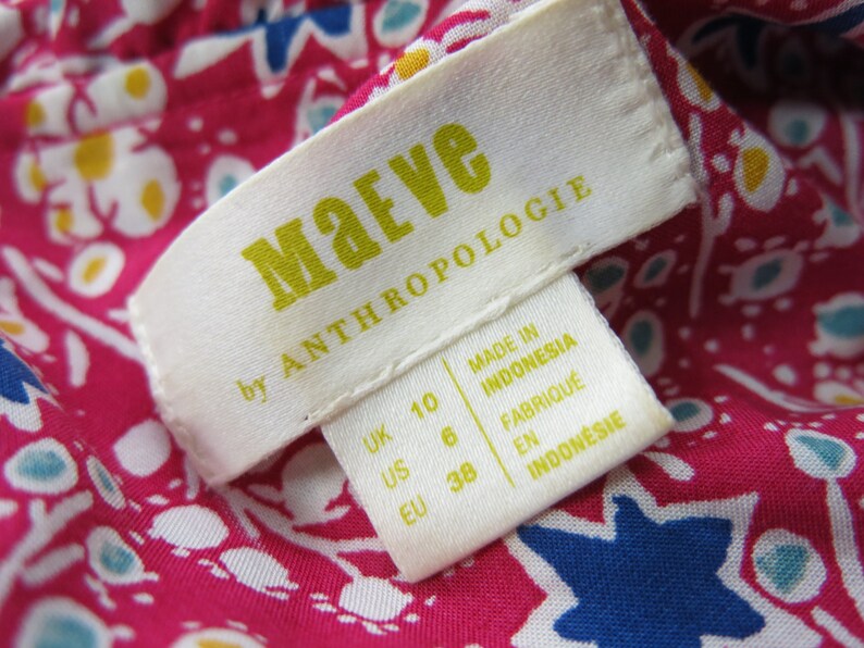 May include: White tag with black text that reads "Maeve by Anthropologie". The tag also includes size information in UK, US, and EU sizes. The tag is made in Indonesia.