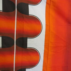 May include: Abstract pattern fabric with a white background and a repeating design of orange and black curved shapes. The fabric has a gradient of orange and red on the right side.