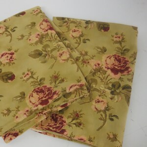 May include: A set of two fabric panels with a floral pattern. The panels are a light green color with a red and pink floral design.