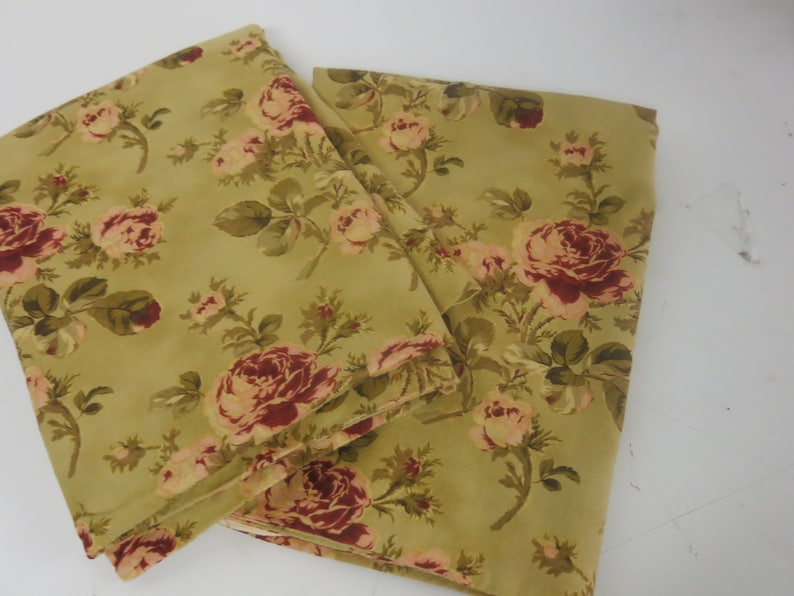 May include: A set of two fabric panels with a floral pattern. The panels are a light green color with a red and pink floral design.