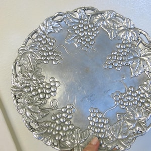 May include: A set of three ceramic mugs with a speckled, matte finish. Each mug features a different color: light blue, cream, and gray. The mugs have a simple, modern design and a comfortable handle.