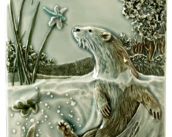 Easily Distracted, North American river otter, ceramic art tile, 4 x 8 inches.