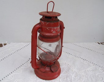 Old made in China paraffin oil lamp. Red finish Hurricane lantern. Fisherman sailor light