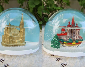 Pair of rare vintage plastic Austrian touristic snow globes: Mariazell Shrine and Wien Stephansdom. Collectible snowdome souvenir