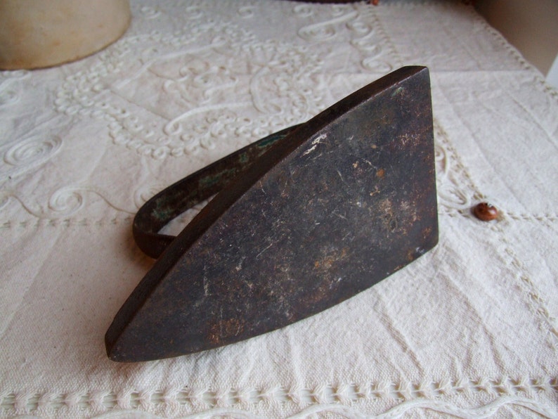 Heavy iron metal decor. Antique Italian 1920s flatiron