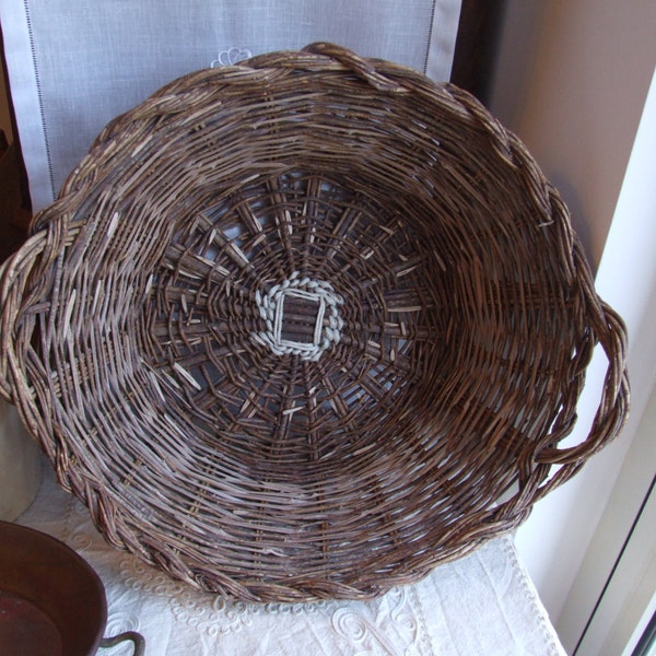 Italian handmade extra-large wicker basket with handles. Old rustic home and kitchen decor.