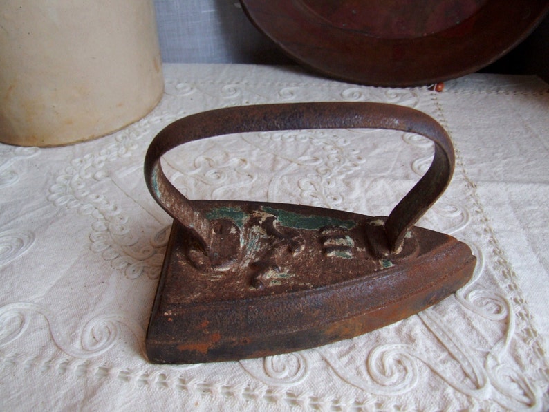 Heavy iron metal decor. Antique Italian 1920s flatiron