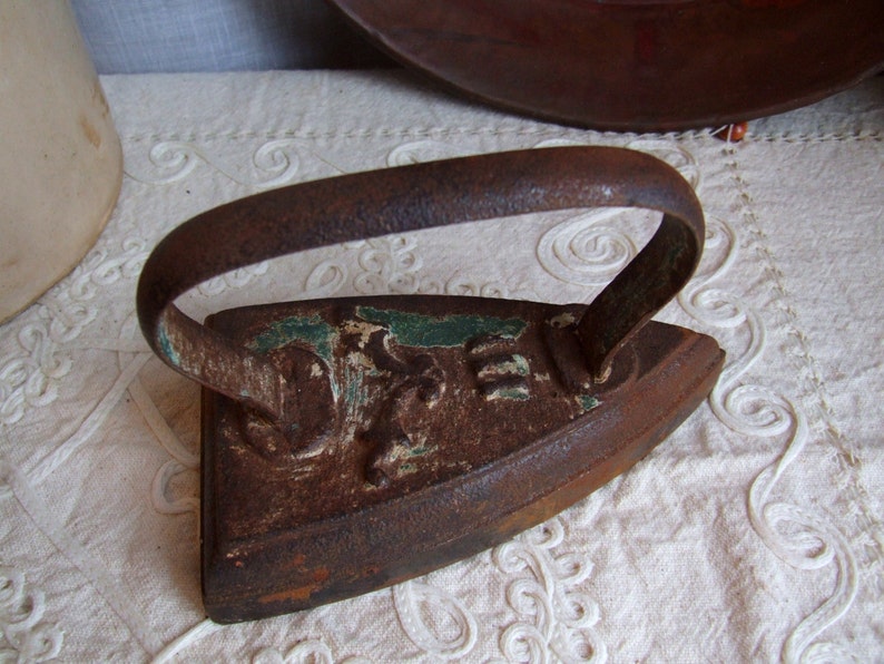 Heavy iron metal decor. Antique Italian 1920s flatiron