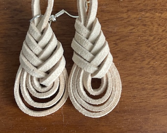 Hand knotted leather earrings.