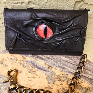 Cartera unisex estilo motero con forma de globo ocular