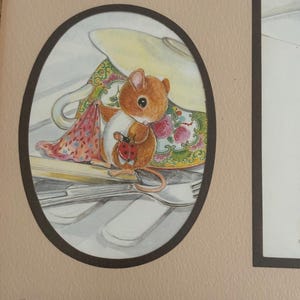 May include: A brown mouse with a red ladybug on its back sits on a teacup and saucer. The teacup is decorated with flowers and has a yellow interior. The mouse is holding a pink and red fabric.