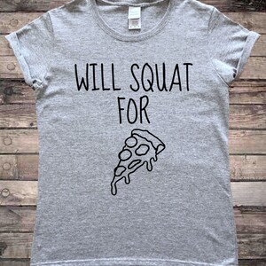 May include: Gray t-shirt with the text "WILL SQUAT FOR" and a black and white illustration of a slice of pizza.