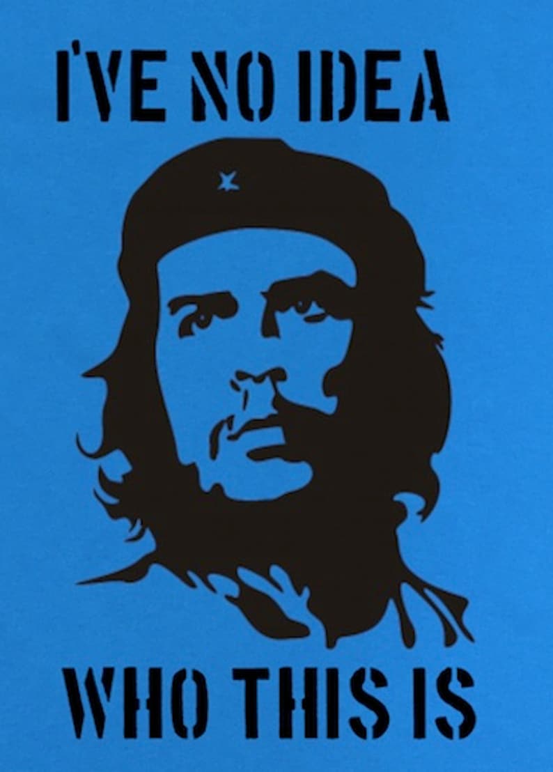 May include: A blue background with a black silhouette of a man with a beard and a hat. The text "I'VE NO IDEA WHO THIS IS" is printed in black below the silhouette.