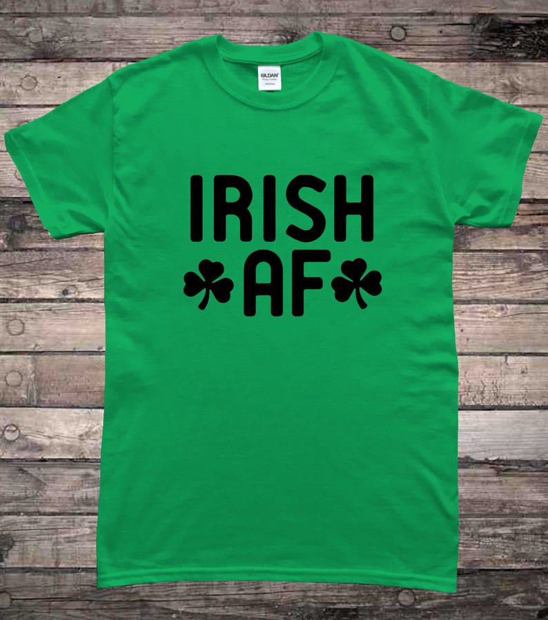 May include: Green t-shirt with black text that reads "IRISH AF" with shamrock symbols on either side of the "AF".