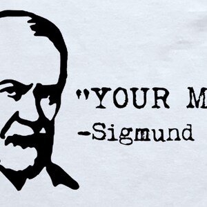 May include: Black and white illustration of Sigmund Freud with the quote "YOUR MUM" attributed to him.