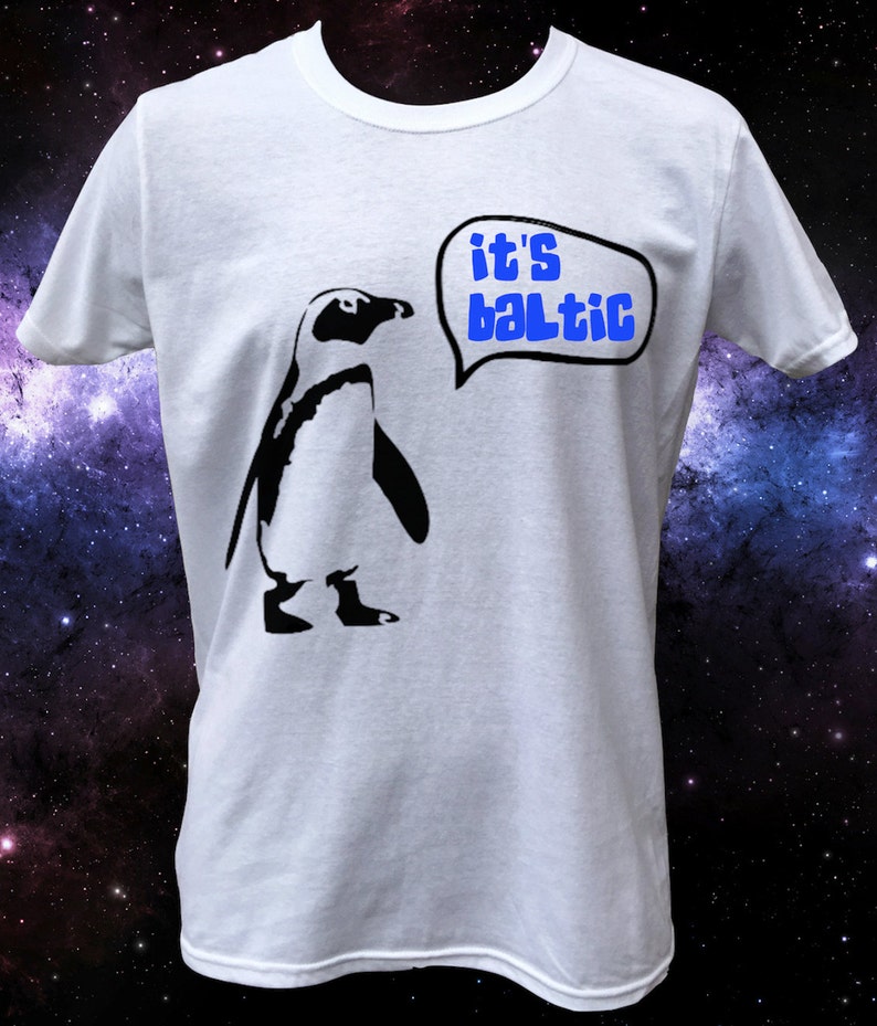 May include: White t-shirt with a black penguin graphic and a speech bubble that says "it's baltic".