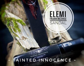 May include: A black cylindrical bottle labeled Tainted Innocence Pure & Natural Oil Blend 10ml 0.33oz, positioned near a dark rectangular stick with a red wax seal. The text Elemi Frankincense Sandal is visible in a white circle overlay.