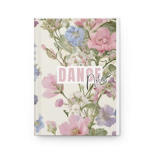 May include: A floral-patterned notebook with the words "DANCE Notes" on the cover. The design features pink, blue, and white flowers with green leaves against a cream background. The notebook is a hardcover style.